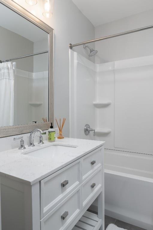 bathroom with shower / bath combo and vanity
