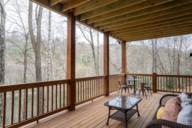 1018N Norton Rd, Cashiers, NC 28717 - deck featuring outdoor dining space and a view of trees