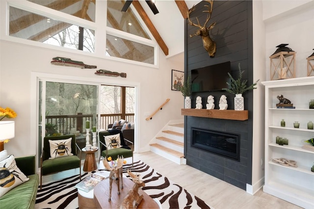 1018N Norton Rd, Cashiers, NC 28717 - living room featuring beamed ceiling, stairs, wood finished floors, high vaulted ceiling, and a fireplace