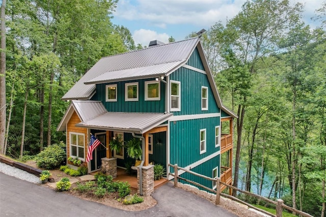 1018N Norton Rd, Cashiers, NC 28717 - chalet / cabin featuring a porch, a metal roof, and a chimney
