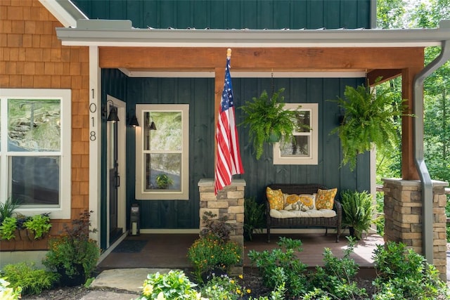 1018N Norton Rd, Cashiers, NC 28717 - view of exterior entry featuring board and batten siding and a porch