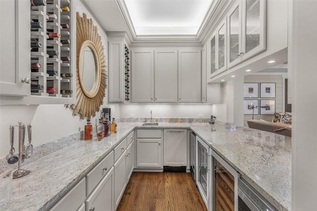 kitchen with wine cooler, dark hardwood / wood-style floors, and white cabinets