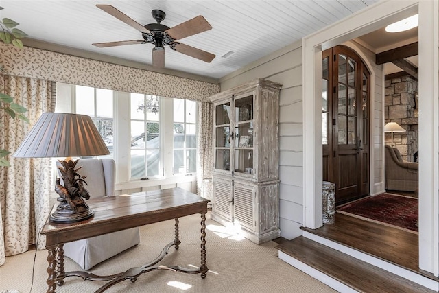 interior space featuring ceiling fan and carpet floors