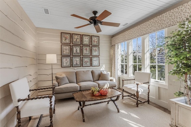 sunroom with ceiling fan