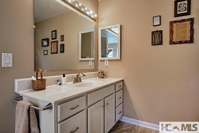 bathroom with tile patterned flooring and vanity