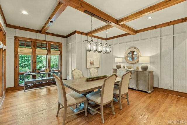 dining room with beam ceiling, light hardwood / wood-style flooring, and coffered ceiling