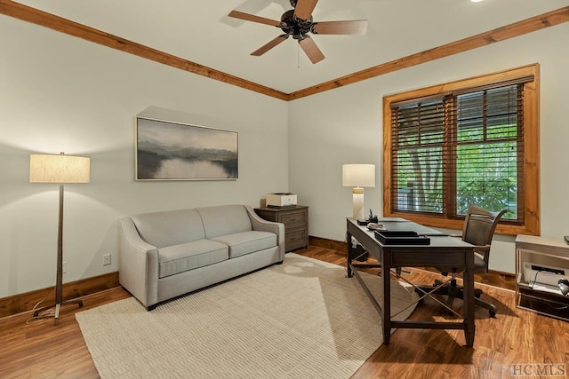 office with hardwood / wood-style flooring, ornamental molding, and ceiling fan