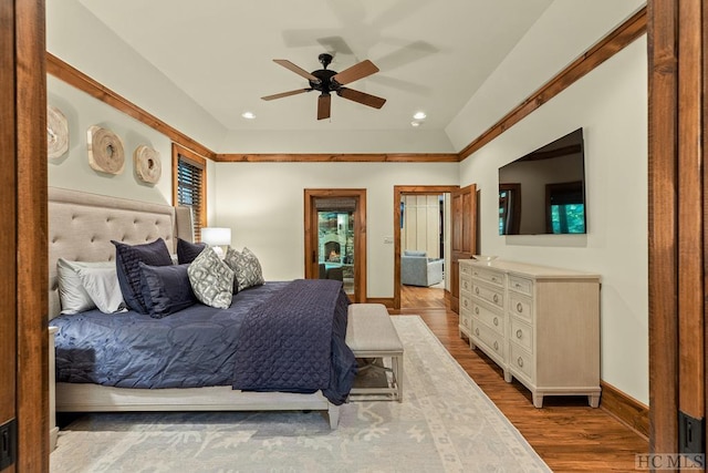 bedroom with light wood-type flooring and ceiling fan