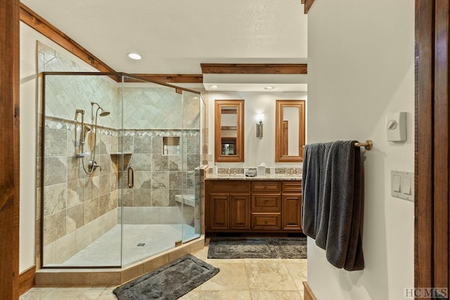 bathroom featuring vanity and walk in shower