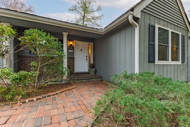 entrance to property with brick siding