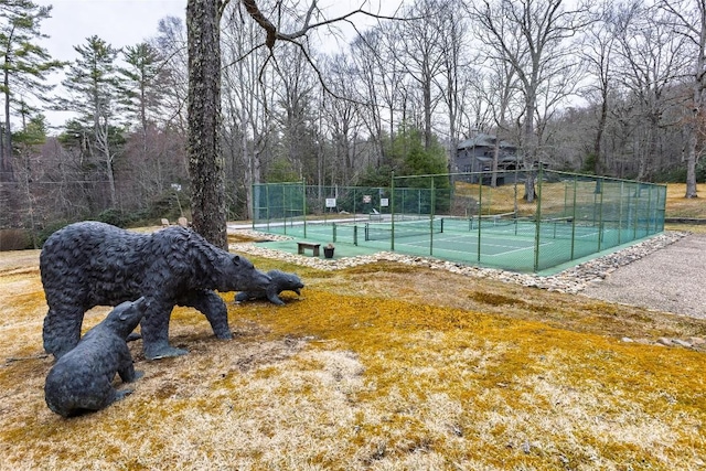 view of sport court with fence