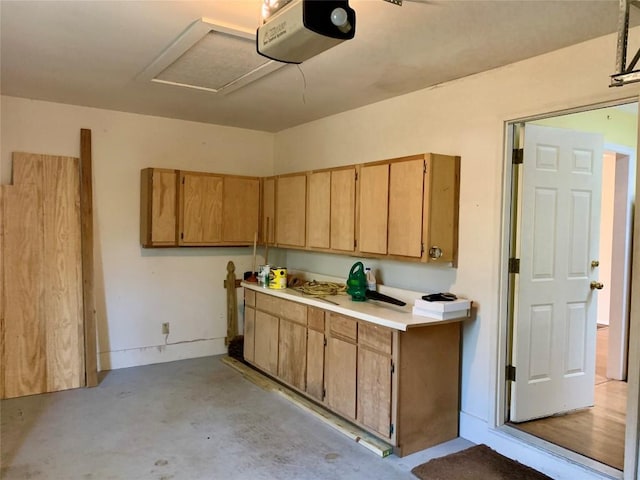 kitchen featuring unfinished concrete floors and light countertops