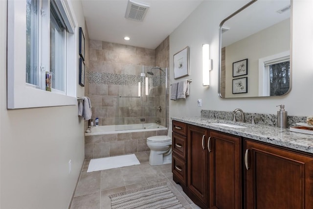 full bathroom with toilet, tile patterned floors, visible vents, and vanity