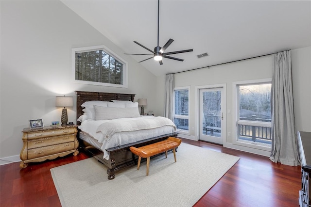 bedroom with access to outside, visible vents, vaulted ceiling, and multiple windows
