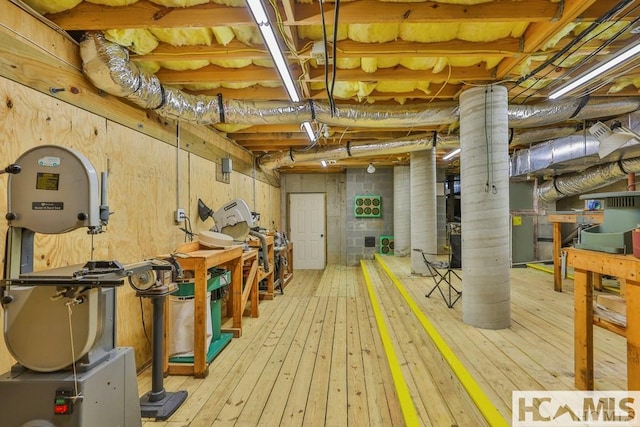 unfinished below grade area with hardwood / wood-style flooring