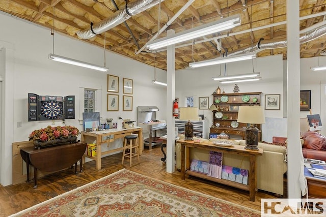 interior space with a desk and wood finished floors
