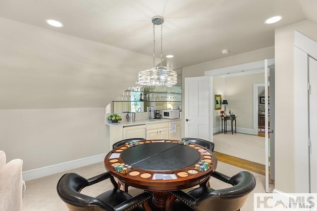 rec room with baseboards, recessed lighting, and bar