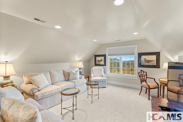 living area with baseboards, vaulted ceiling, and recessed lighting