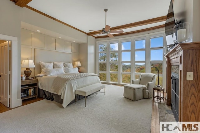 bedroom with a fireplace, ornamental molding, and recessed lighting