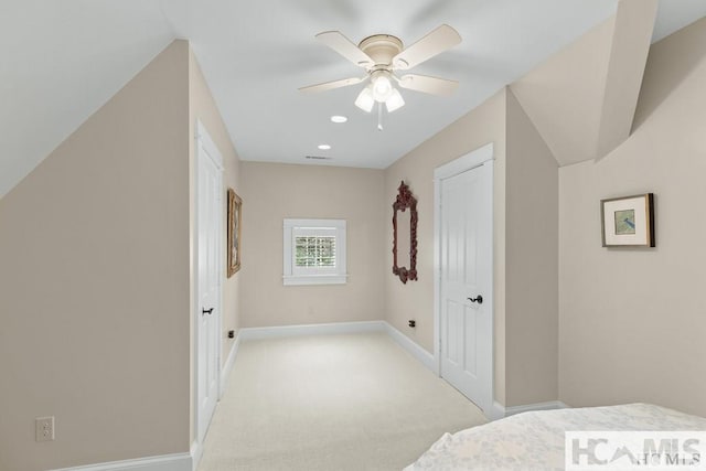 unfurnished bedroom with baseboards, light colored carpet, a ceiling fan, and recessed lighting