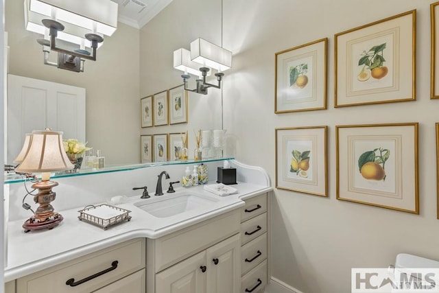 bathroom featuring vanity and ornamental molding