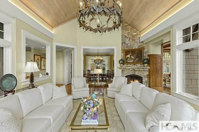 living area featuring a chandelier, wooden ceiling, lofted ceiling, and a stone fireplace