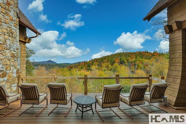 deck featuring a forest view