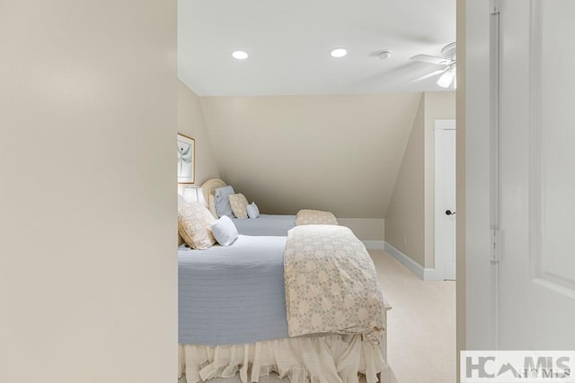 bedroom with lofted ceiling, light colored carpet, recessed lighting, baseboards, and a ceiling fan
