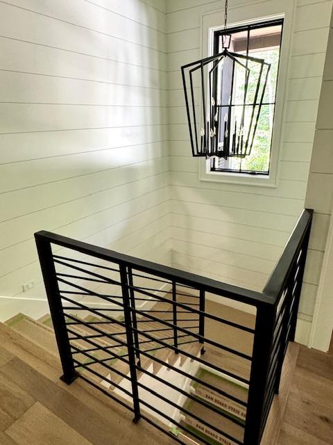 34 Crescent Trl, Highlands, NC 28741 - stairs featuring a chandelier and wood finished floors