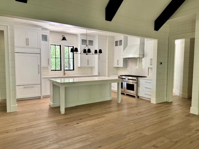 34 Crescent Trl, Highlands, NC 28741 - kitchen featuring high end appliances, custom range hood, white cabinets, and light countertops