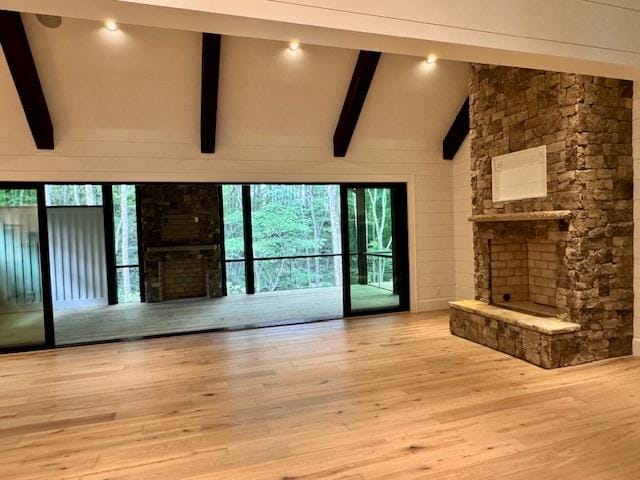 34 Crescent Trl, Highlands, NC 28741 - unfurnished living room featuring a stone fireplace and wood finished floors