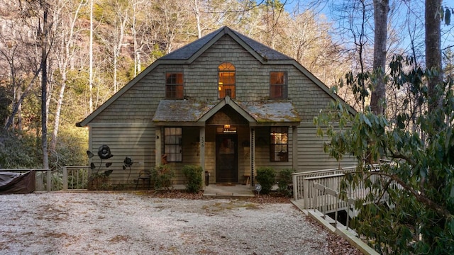 view of front of property featuring roof with shingles