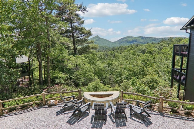 665 Trays Island Rd, Sapphire, NC 28774 - view of patio featuring a forest view, a fire pit, and a mountain view