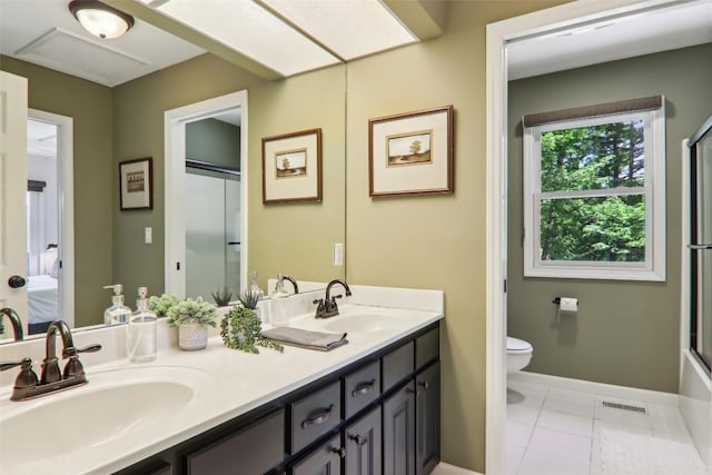 665 Trays Island Rd, Sapphire, NC 28774 - ensuite bathroom featuring double vanity, toilet, and baseboards