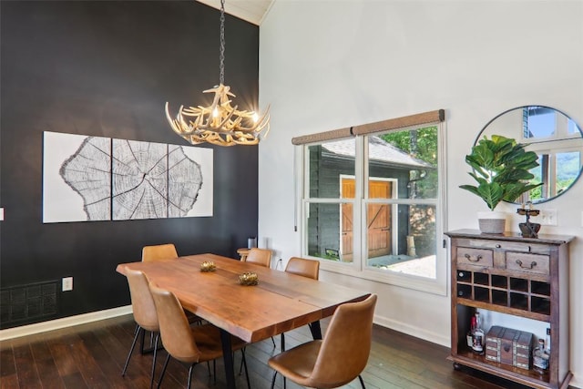 665 Trays Island Rd, Sapphire, NC 28774 - dining room with a chandelier, hardwood / wood-style flooring, baseboards, and high vaulted ceiling