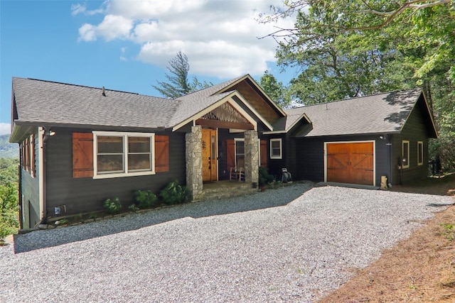 665 Trays Island Rd, Sapphire, NC 28774 - view of front of house with an attached garage, a shingled roof, and gravel driveway