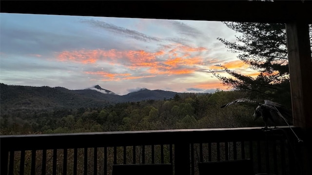 665 Trays Island Rd, Sapphire, NC 28774 - view of mountain background featuring a heavily wooded area