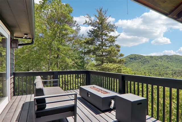 665 Trays Island Rd, Sapphire, NC 28774 - deck featuring an outdoor fire pit and a mountain view
