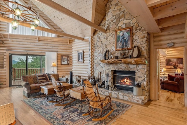 267 Hero Ln, Glenville, NC 28736 - living room featuring rustic walls, a fireplace, high vaulted ceiling, wood finished floors, and a wooden ceiling with exposed beams