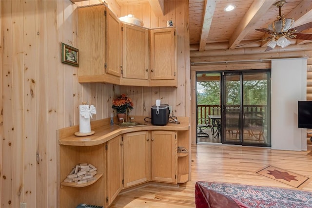 267 Hero Ln, Glenville, NC 28736 - kitchen with a wooden ceiling with exposed beams, light wood-type flooring, light countertops, light brown cabinetry, and wood walls