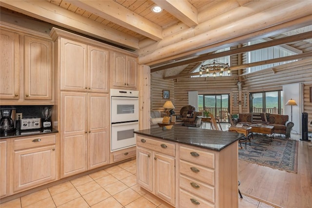 267 Hero Ln, Glenville, NC 28736 - kitchen featuring double oven, light brown cabinets, log walls, a wooden ceiling with exposed beams, and open floor plan