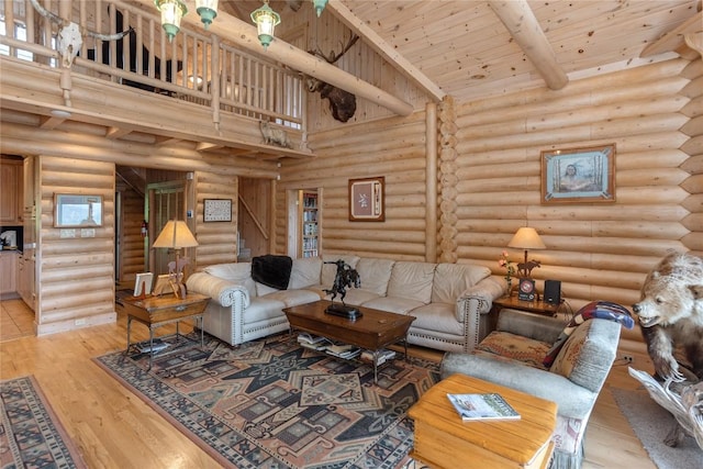 267 Hero Ln, Glenville, NC 28736 - living room featuring stairs, rustic walls, light wood-style flooring, and a wooden ceiling with exposed beams