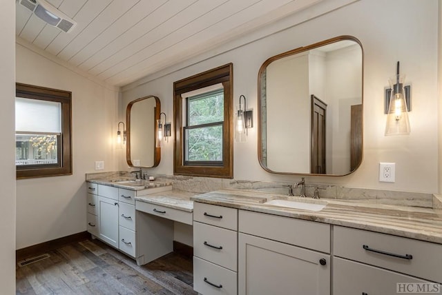 bathroom featuring lofted ceiling, vanity, hardwood / wood-style flooring, and wooden ceiling