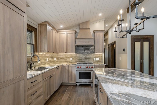 kitchen featuring light brown cabinetry, sink, decorative light fixtures, dark hardwood / wood-style floors, and designer stove