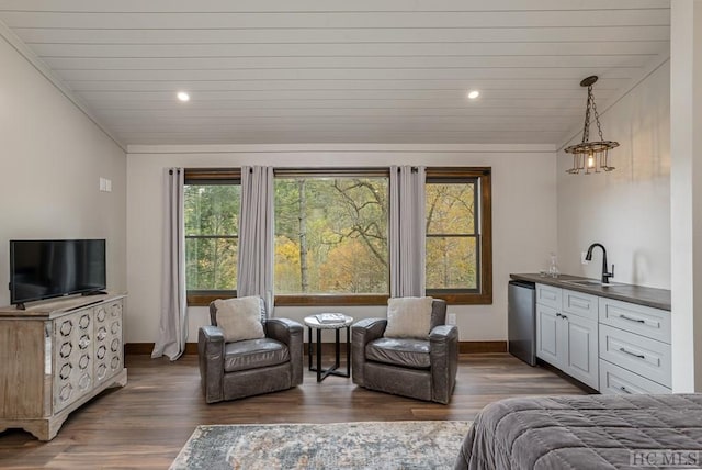 bedroom featuring dark wood-type flooring, lofted ceiling, sink, and wooden ceiling