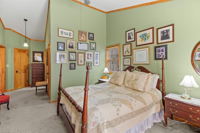 bedroom featuring ornamental molding, high vaulted ceiling, and light carpet