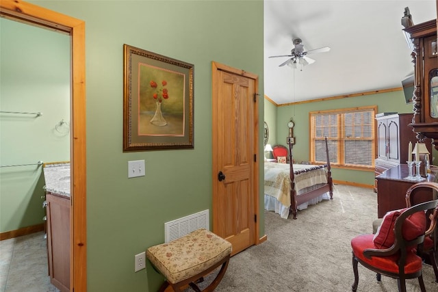 bedroom featuring lofted ceiling and light colored carpet