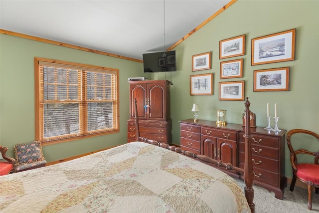 bedroom with vaulted ceiling, crown molding, and light carpet