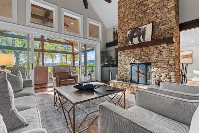 108 W View Way, Highlands, NC 28741 - living area with high vaulted ceiling, beamed ceiling, a stone fireplace, wood finished floors, and ceiling fan