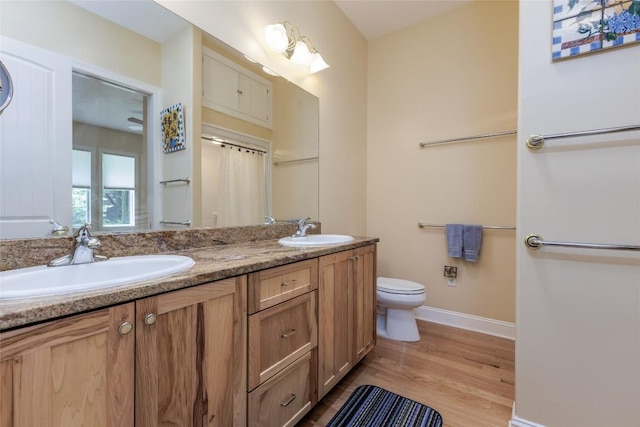 135 Whisper Lake Dr, Sapphire, NC 28774 - full bathroom featuring double vanity and wood finished floors